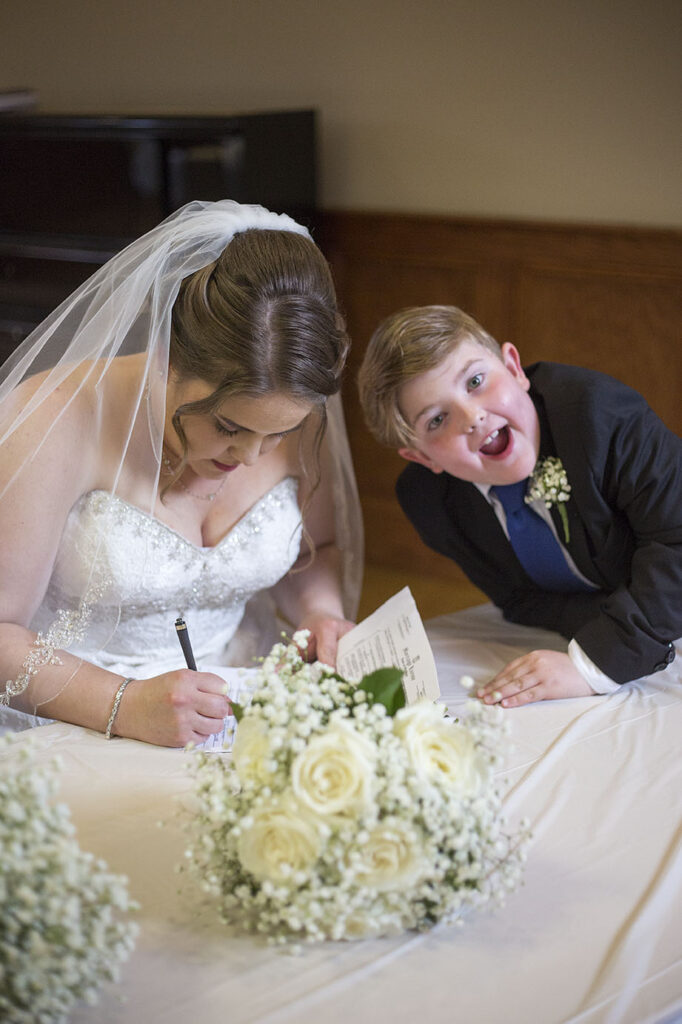 Bride's son making a silly face at Plymouth wedding