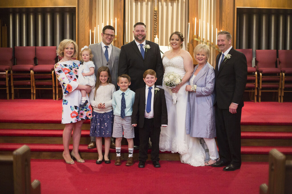 Bride and groom with all of the Plymouth wedding guests