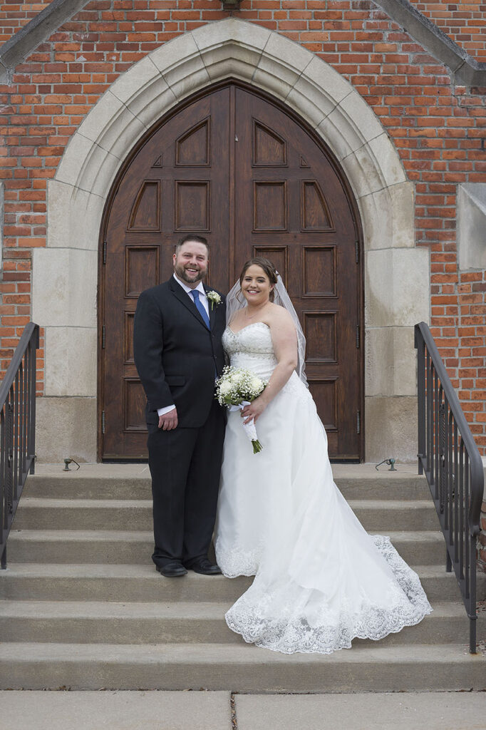 Plymouth wedding couples standing on Presbyterian church steps