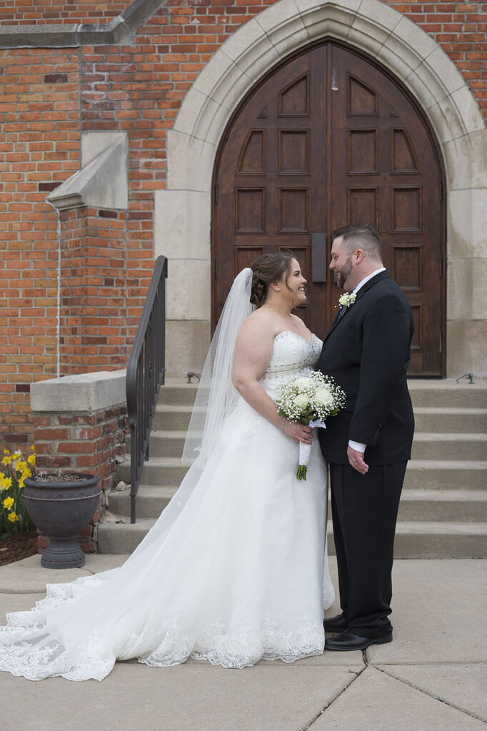 Plymouth wedding couple in front of church steps