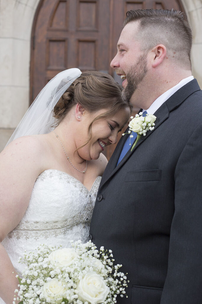 Plymouth wedding laughing together