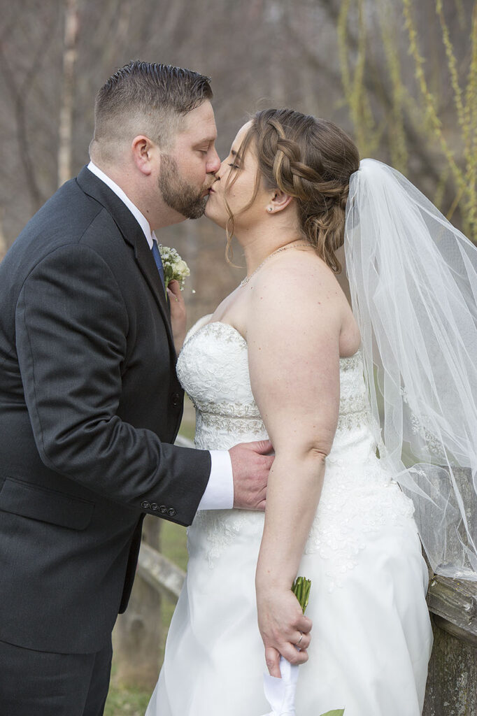 Bride and groom kissing after Plymouth wedding