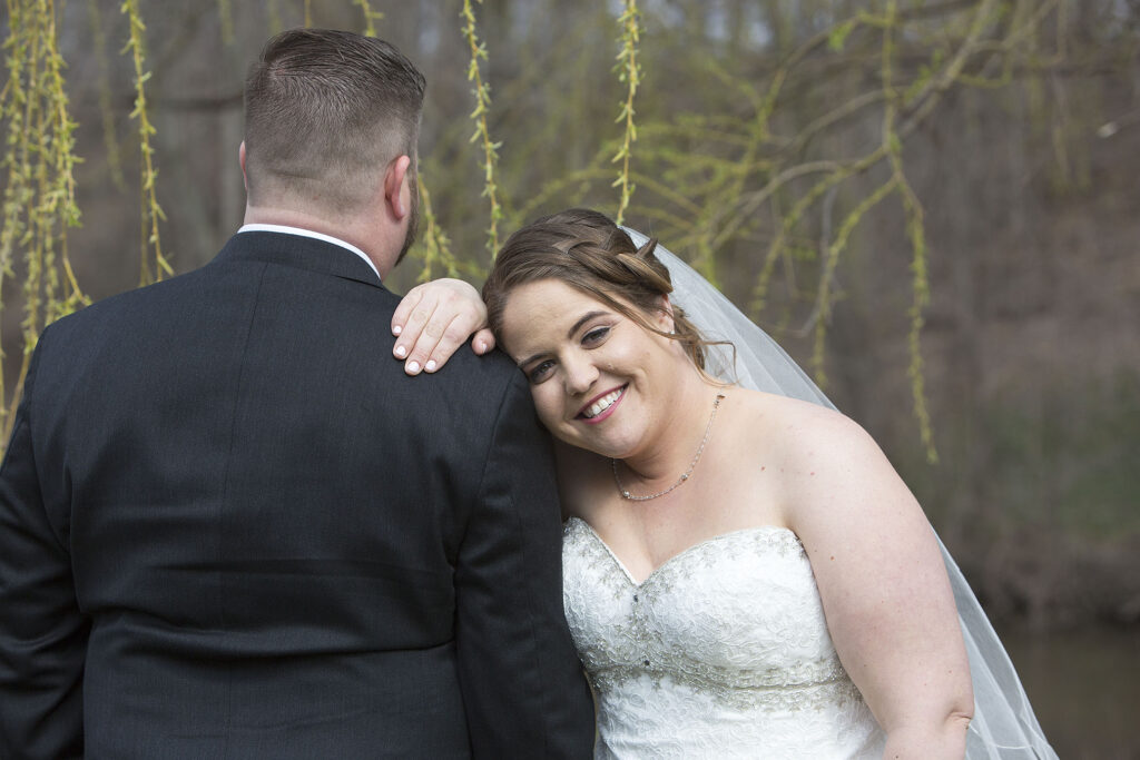 Bride resting head on groom's shoulder Plymouth wedding