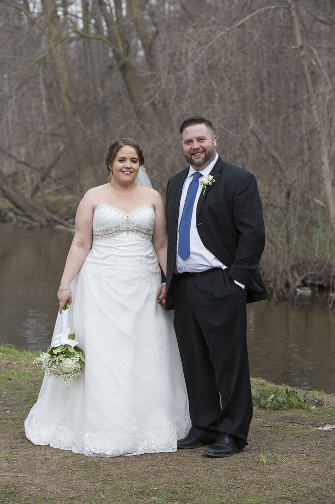 Plymouth wedding couple standing next to river at Parmenters Cider Mill