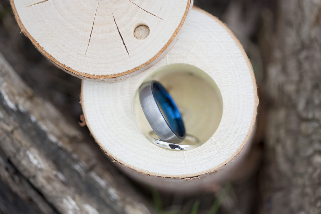 Wedding rings in wooden box Plymouth wedding