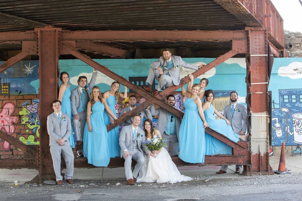 Wedding party gather with bride and groom