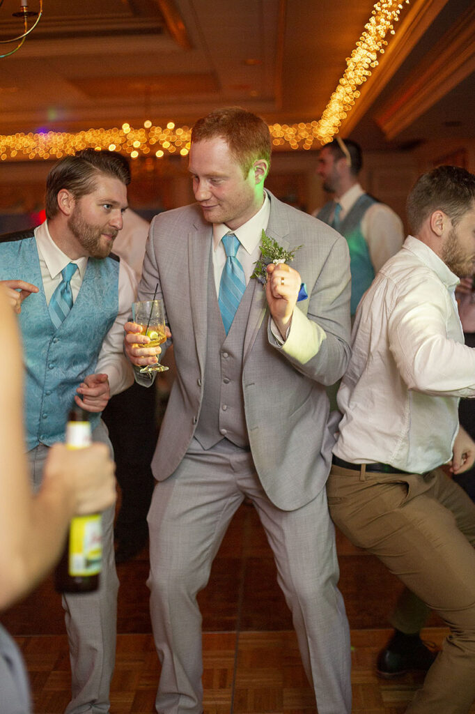 Groom dancing during Jackson Country Club wedding