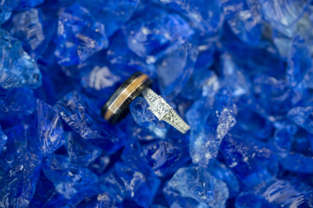 Wedding rings in blue fire glass Westland wedding