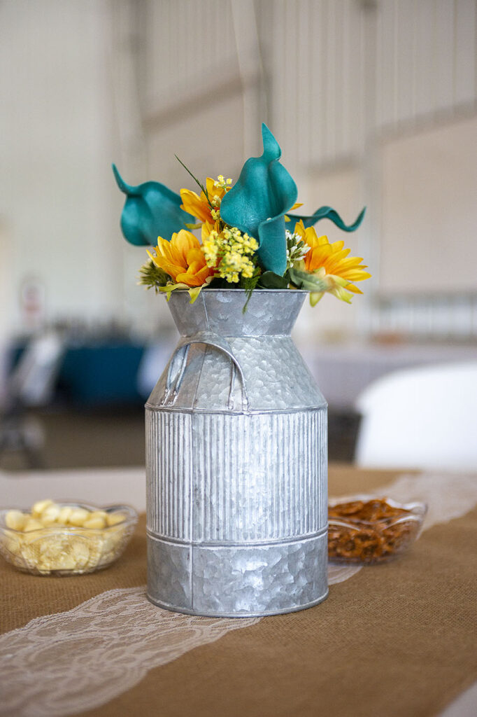 Teal and yellow sunflower centerpieces at Addison wedding