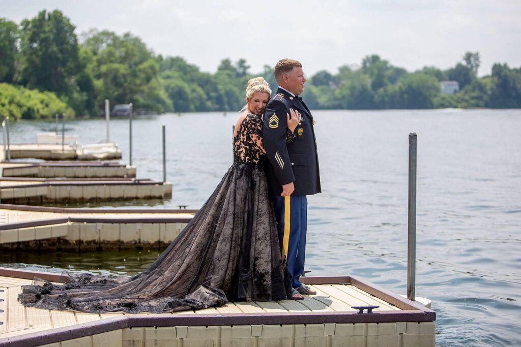 Michigan wedding couple embracing on dock on Belleville Lake.