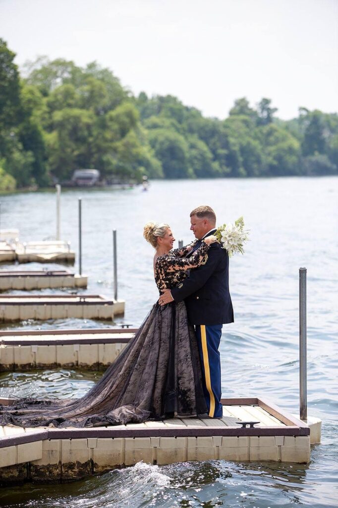 Belleville Lake wedding couple hug on the dock.