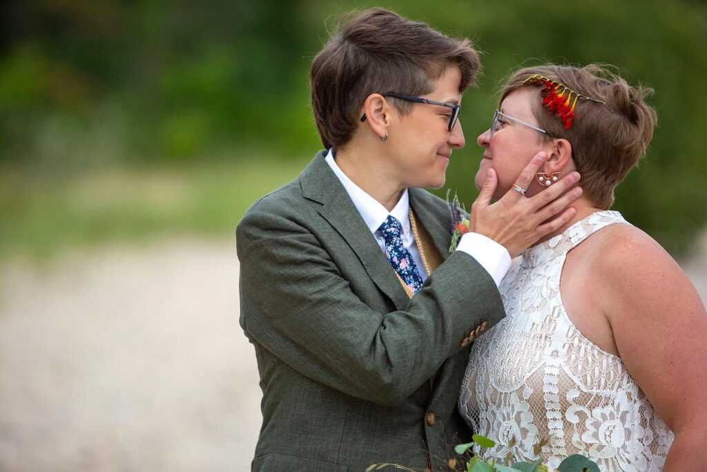 Michigan lesbian couple leans in for a kiss.