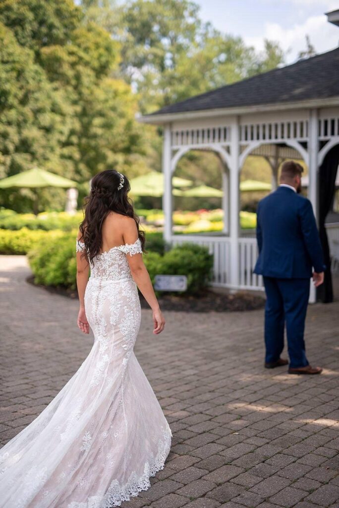 First look between bride and groom at their Wellers Carriage House wedding in Saline, Michigan.