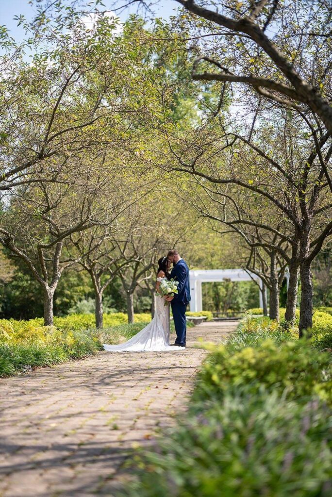 Ann Arbor wedding photographer take photo of couple at Wellers Carriage House wedding.