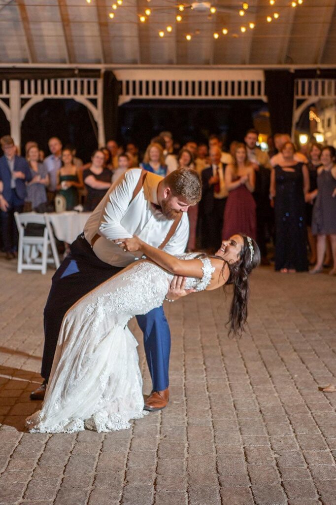 Groom dips bride during their first dance at their Saline wedding.