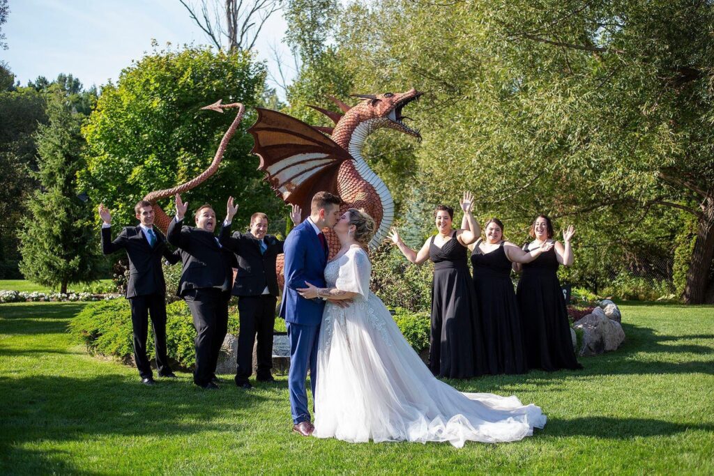 Wedding party in front of Norm the Dragon at Castle Farms in Charlevoix.