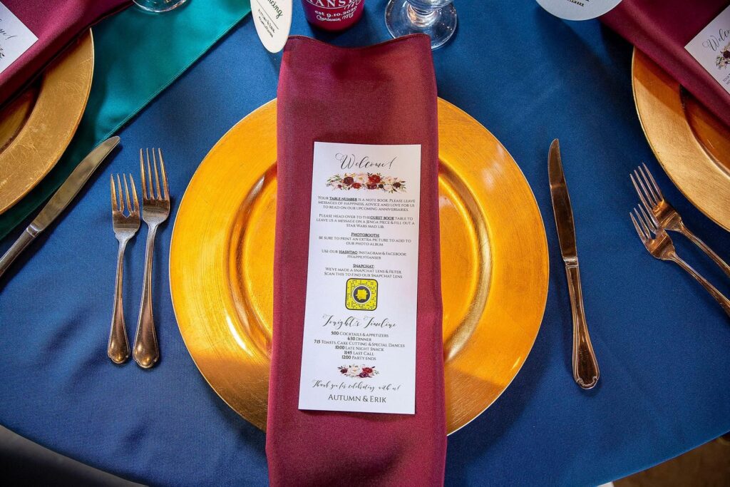 Jewel-toned wedding place setting at up north Michigan.wedding