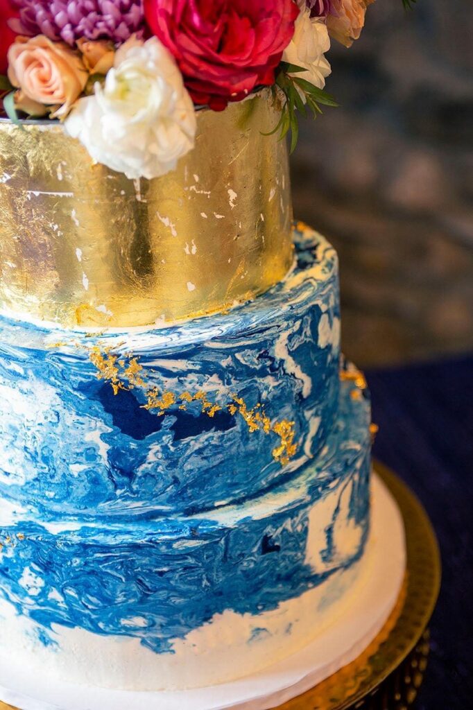 Blue and gold cake at Castle Farms wedding.