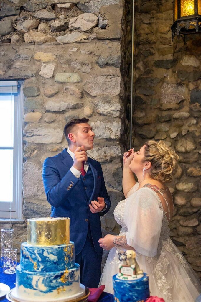 Couple during the cake cutting at Castle Farms.