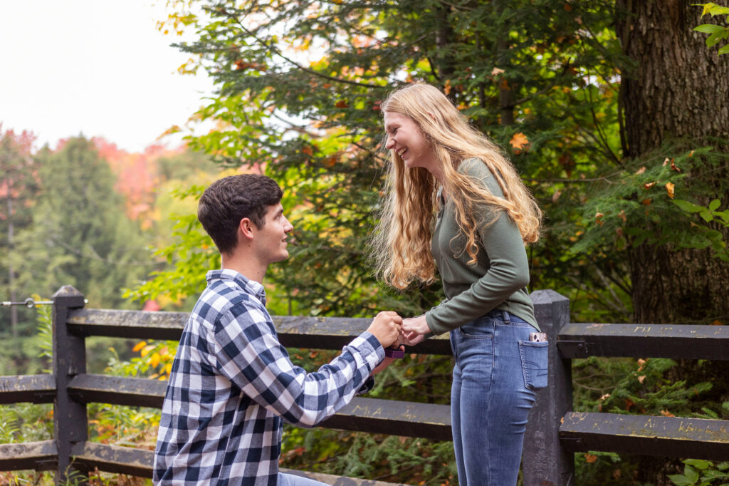 Upper Peninsula wedding photographer captures surprise proposal at Tahquamenon Falls.