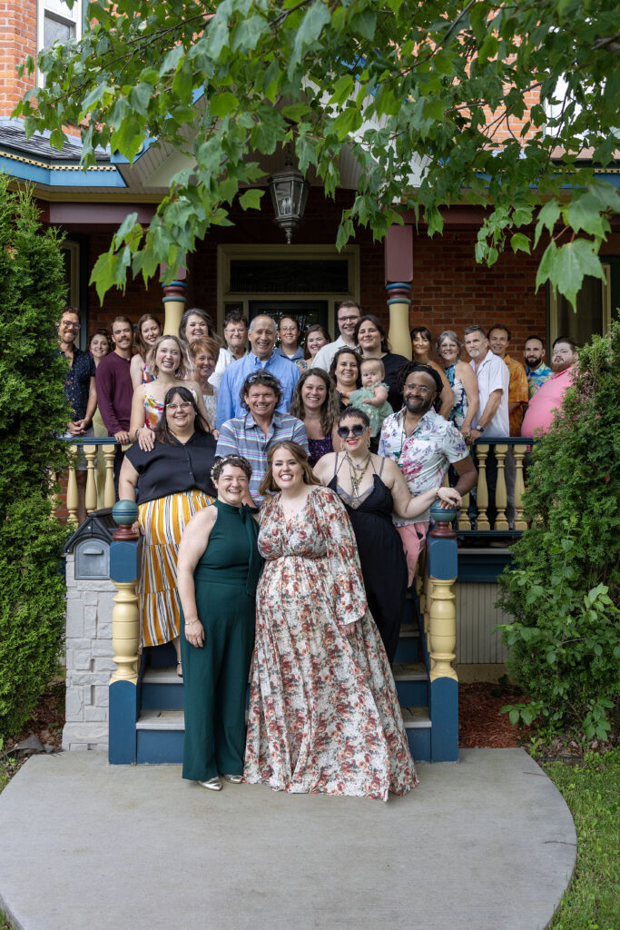 Ishpeming wedding guests pose on the front porch of the AirBNB.