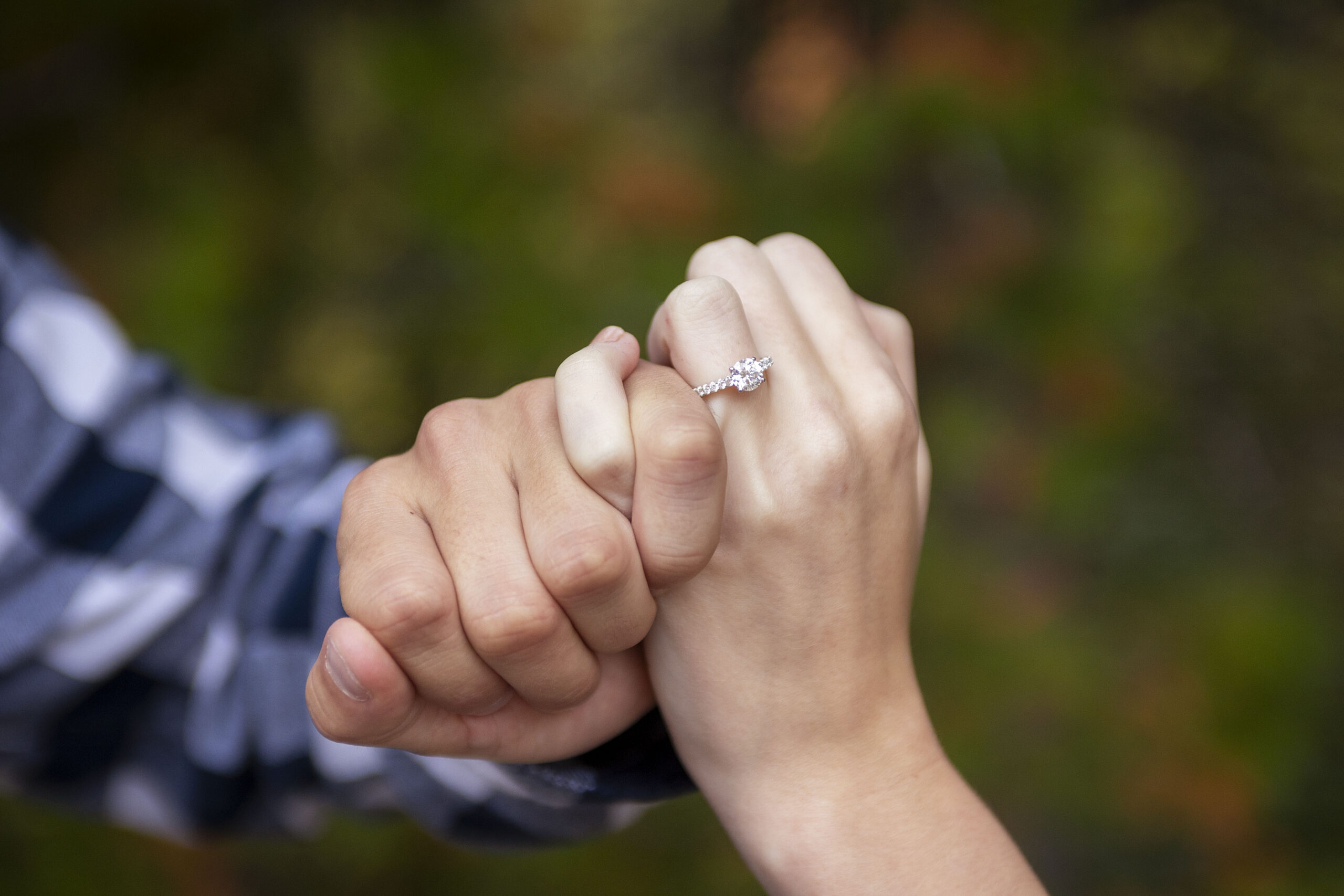 Michigan Upper Peninsula wedding photographer, Pine & Promise, takes photos of a Tahquamenon Falls proposal.