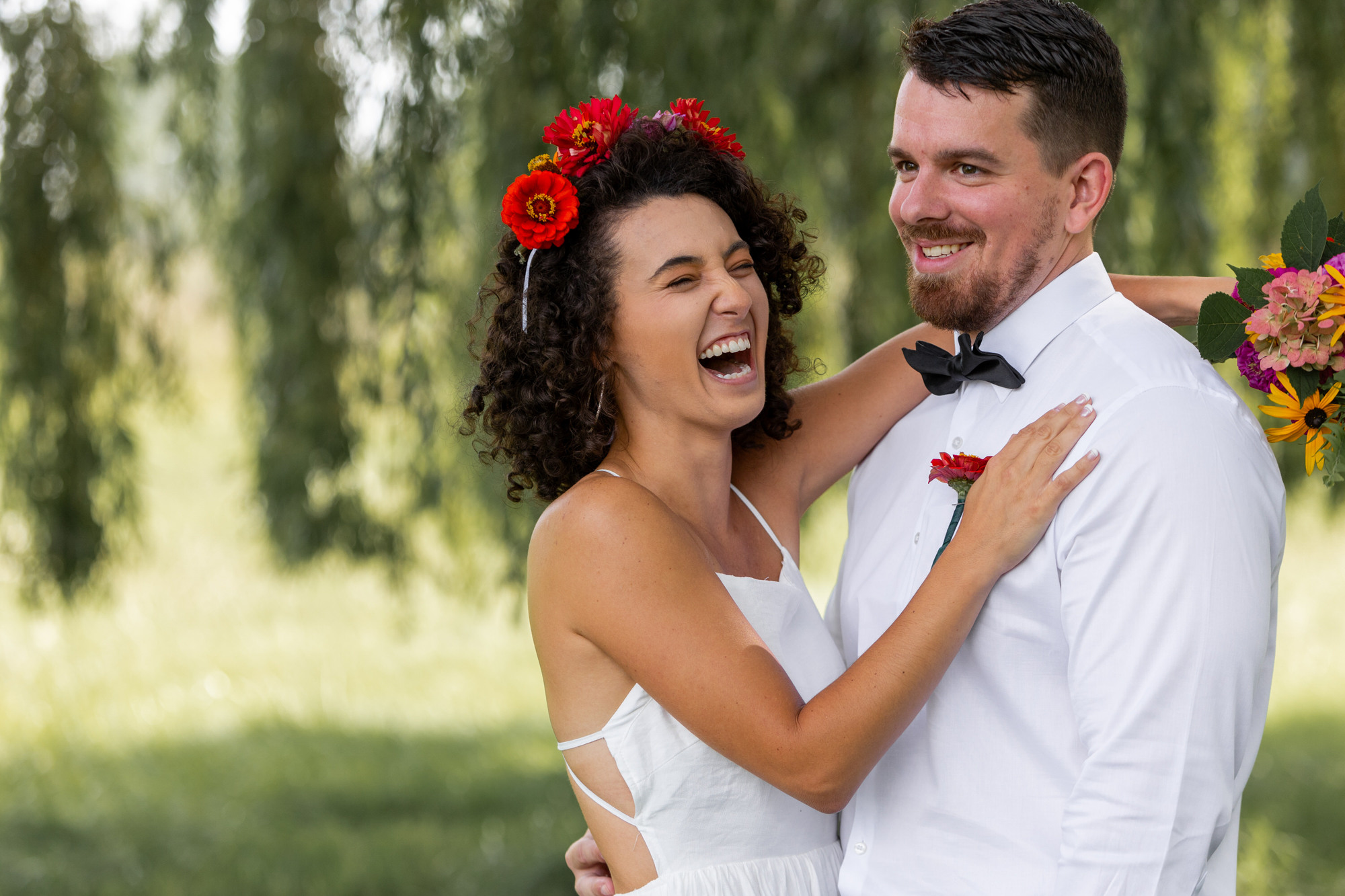 Pinckney Michigan wedding photographer takes photos beneath a willow tree. Six hour wedding collection.