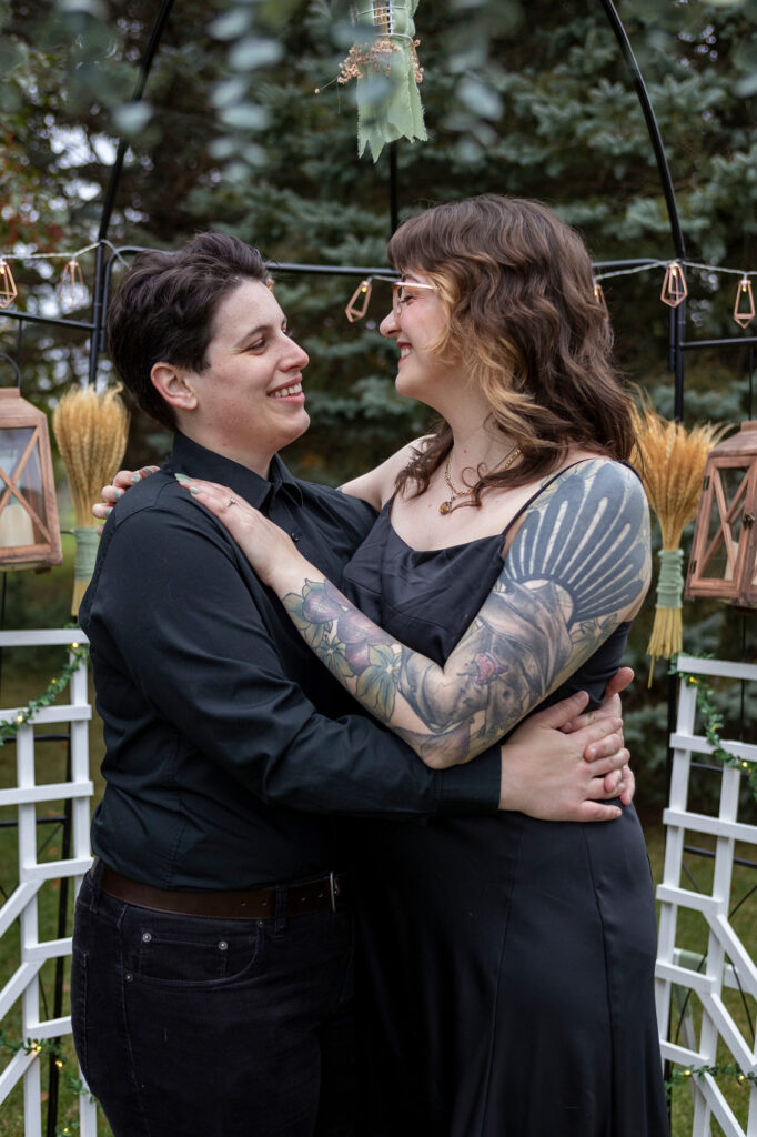 Queer couple hug each other after Dexter proposal