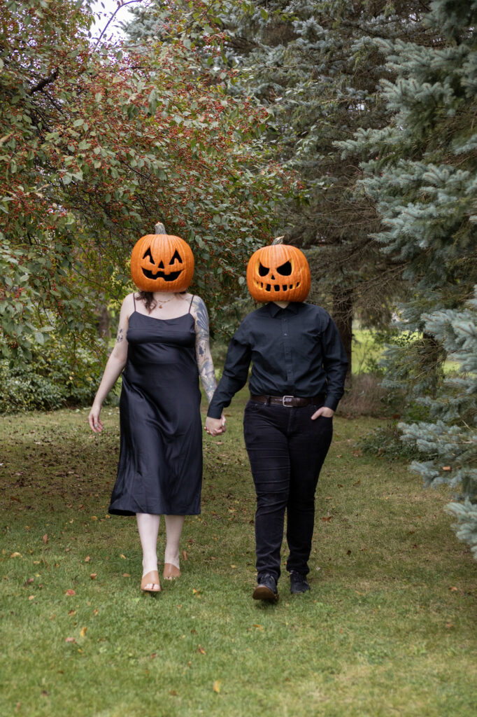 Carved pumpkin head couples photos