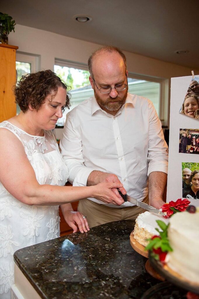 Bride and Groom cuts their wedding cake