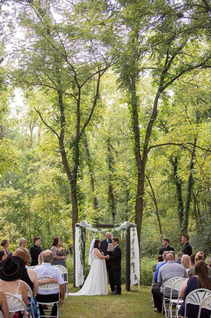 Couple standing at the altar on Hidden Irish Hill at their Brooklyn Michigan wedding