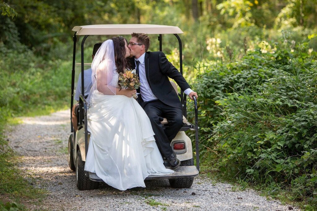 Couple drives off on golf cart at Irish Hills wedding