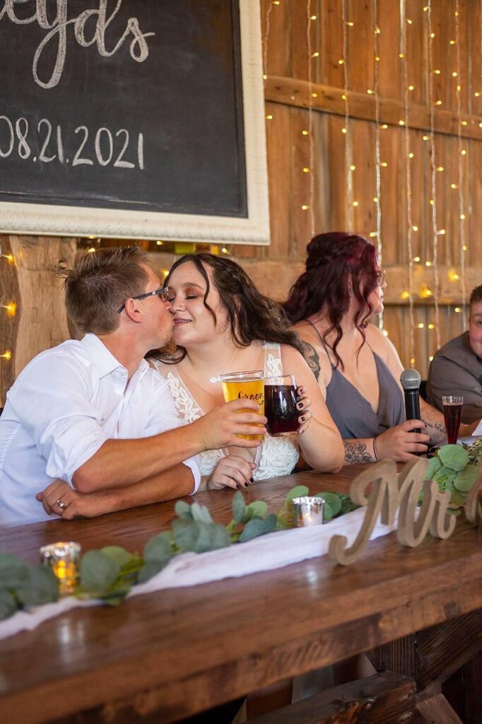 Mr and Mrs kiss during the toasts