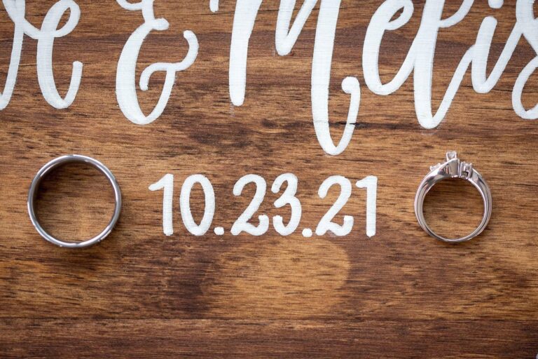 Wedding rings on a custom sign at Fort Pontchartrain wedding in Detroit.