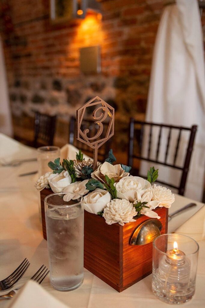 Centerpiece with white roses and table number