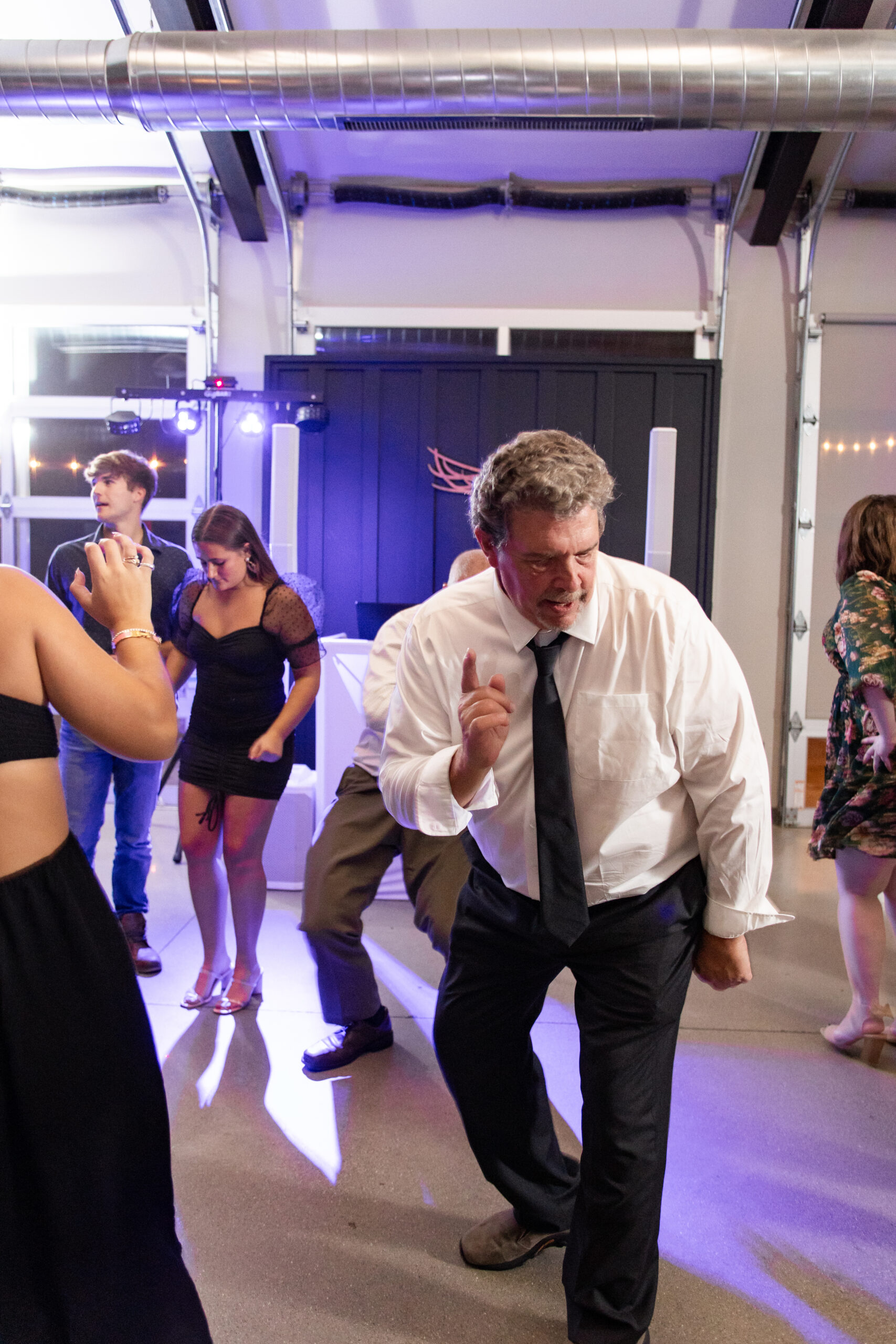 Michigan wedding guest dances at reception