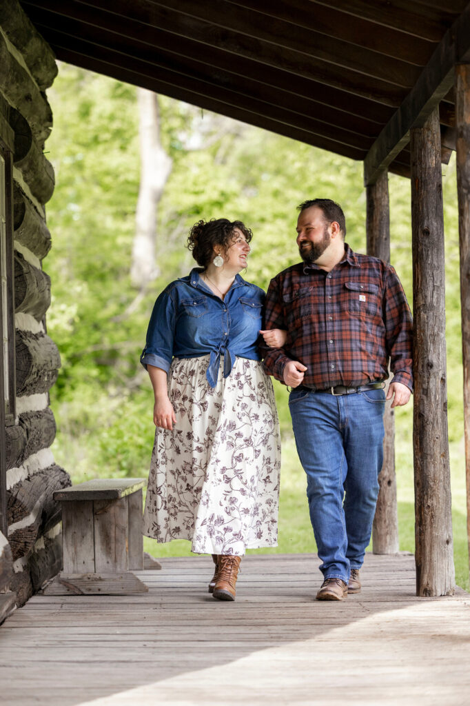 Couple laughing together at Woldumar Nature Center engagement session