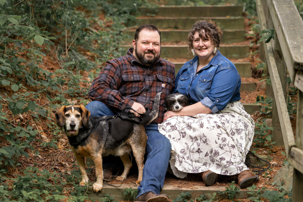 Couple sitting together on wooden steps on Woldumar nature trails