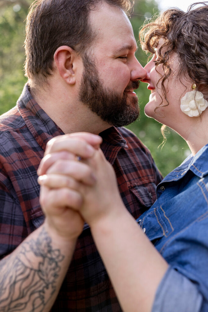 Close up of couple almost kissing during their Woldumar engagement photos.