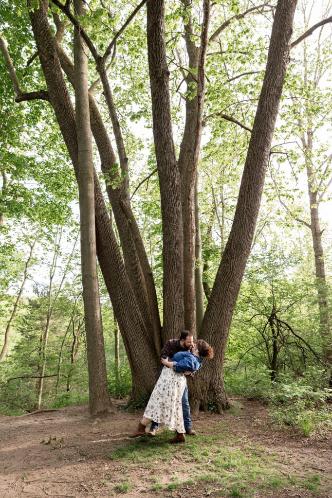 Collin dips and kisses Natalie in front of massive tree