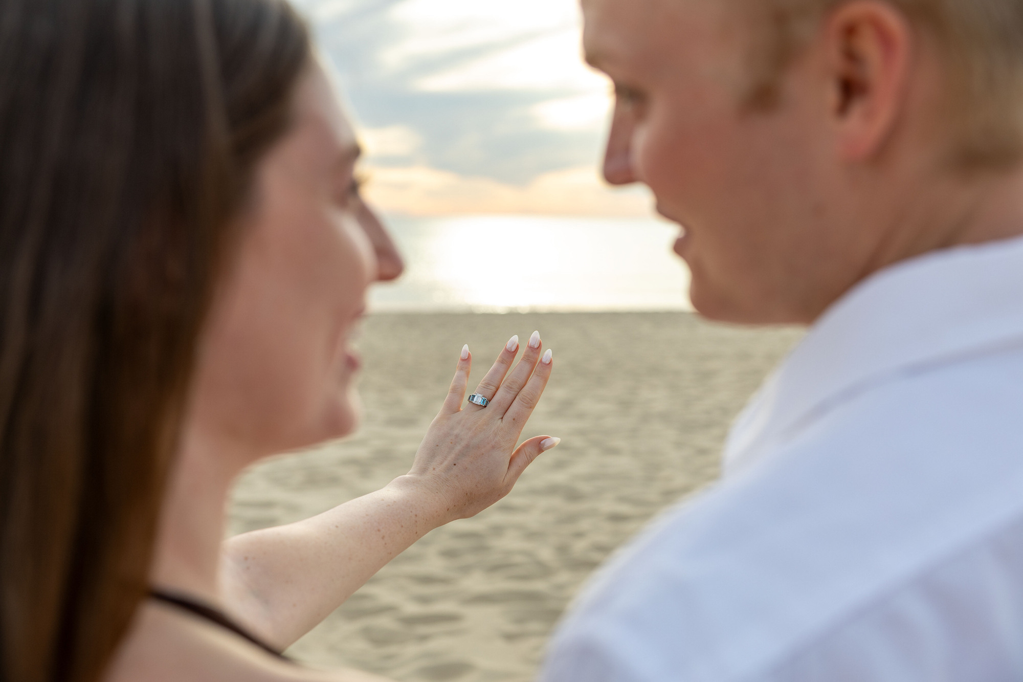 Newly engaged Michigan couple shows off custom engagement ring.